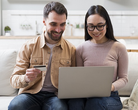 front view smiley couple shopping online 1